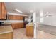 Bright kitchen featuring tile floors, wooden cabinetry, and stainless steel appliances at 22672 W Solano Dr, Buckeye, AZ 85326