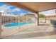 Inviting pool area with an enclosed fence, providing a secure and refreshing outdoor oasis at 22672 W Solano Dr, Buckeye, AZ 85326