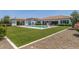 Expansive backyard featuring artificial lawn and refreshing pool with slide, perfect for outdoor fun at 24372 N 96Th Ln, Peoria, AZ 85383
