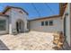 Outdoor patio with string lights and travertine at 24372 N 96Th Ln, Peoria, AZ 85383