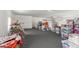 Finished basement with carpet and lots of space for storage, recreation, or customization at 24372 N 96Th Ln, Peoria, AZ 85383