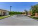 Outdoor basketball court and adjacent covered seating area with lush landscaping at 24372 N 96Th Ln, Peoria, AZ 85383