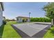 Outdoor basketball court with lighting and adjacent covered seating area overlooking the court at 24372 N 96Th Ln, Peoria, AZ 85383