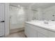 Bright bathroom features a walk-in glass shower and white vanity with large mirror for a luxurious experience at 24372 N 96Th Ln, Peoria, AZ 85383