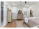 Bright bedroom with white shutters and wood floors offers a soothing retreat at 24372 N 96Th Ln, Peoria, AZ 85383