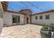 Charming courtyard with tiled flooring and string lights, perfect for outdoor relaxation at 24372 N 96Th Ln, Peoria, AZ 85383