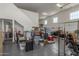 Spacious garage with epoxy flooring providing ample room for parking and storage at 24372 N 96Th Ln, Peoria, AZ 85383