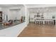 Expansive kitchen with white cabinets, stainless appliances, and views into the living area at 24372 N 96Th Ln, Peoria, AZ 85383