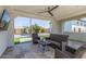 Outdoor patio area with comfortable seating and views of the basketball court at 24372 N 96Th Ln, Peoria, AZ 85383