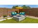 Inviting outdoor lounge area with comfortable seating, fire pit, and stylish decor, perfect for relaxing and entertaining at 25289 N 143Rd Dr, Surprise, AZ 85387
