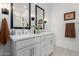 Stylish bathroom with double vanity, modern fixtures, and decorative accents, offering both functionality and elegance at 3053 W Straight Arrow Ln, Phoenix, AZ 85083