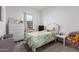 Charming bedroom with a green and white theme, featuring a dresser, decorations, and a cozy atmosphere at 3053 W Straight Arrow Ln, Phoenix, AZ 85083