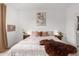 Comfortable bedroom with a queen-size bed, soft lighting, and minimalist decor for a relaxing and restful ambiance at 3053 W Straight Arrow Ln, Phoenix, AZ 85083