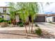 Charming home featuring a desert landscape with colorful bougainvillea and a neutral color scheme at 3053 W Straight Arrow Ln, Phoenix, AZ 85083