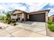 Single Gathering home featuring a desert landscape, neutral color scheme, and a two car garage at 3053 W Straight Arrow Ln, Phoenix, AZ 85083