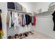 Organized walk-in closet with ample storage, clothing racks, and shelving, providing a practical and stylish space at 3053 W Straight Arrow Ln, Phoenix, AZ 85083