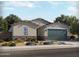 Beautiful single-story home featuring stone accents, desert landscaping, and a two-car garage at 326 S San Gregorio Ln, Casa Grande, AZ 85194