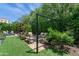 Lush backyard with a seating area, water feature, and well-maintained landscaping at 3511 N 39Th Pl, Phoenix, AZ 85018