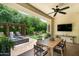 Charming backyard featuring a covered patio, water feature, and outdoor seating area at 3511 N 39Th Pl, Phoenix, AZ 85018