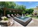 Relaxing backyard retreat with a water feature and lounge chairs under a pergola at 3511 N 39Th Pl, Phoenix, AZ 85018