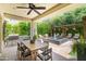 Serene backyard with covered patio, water feature, and well-manicured landscaping at 3511 N 39Th Pl, Phoenix, AZ 85018