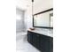 Stylish bathroom with marble countertops, black cabinets and modern fixtures at 3511 N 39Th Pl, Phoenix, AZ 85018