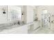 Bright bathroom with marble countertops, dual sinks, and a large mirror at 3511 N 39Th Pl, Phoenix, AZ 85018