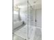 Elegant bathroom with glass enclosed shower, tub, and marble tile flooring at 3511 N 39Th Pl, Phoenix, AZ 85018