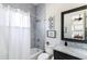 Stylish bathroom features marble tile, a shower and tub combination, plus a vanity with dark cabinets at 3511 N 39Th Pl, Phoenix, AZ 85018