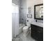 Elegant bathroom featuring marble tile, a bathtub and shower combination, and vanity with dark cabinets at 3511 N 39Th Pl, Phoenix, AZ 85018