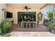 Inviting covered patio featuring a dining table, ceiling fan and outdoor grill at 3511 N 39Th Pl, Phoenix, AZ 85018