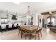 Open dining and kitchen area featuring updated appliances and a central island at 3511 N 39Th Pl, Phoenix, AZ 85018