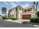 Attractive two-story stone home featuring an attached two car garage and manicured landscaping at 3511 N 39Th Pl, Phoenix, AZ 85018