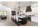 Spacious kitchen with large island with seating, light wood floors, and stainless steel appliances at 3511 N 39Th Pl, Phoenix, AZ 85018