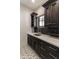 Laundry room features dark cabinets, patterned tile floor, light countertops, and a stainless steel sink at 3511 N 39Th Pl, Phoenix, AZ 85018