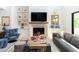 Cozy living room with a stone fireplace, comfortable seating, and stylish decor at 3511 N 39Th Pl, Phoenix, AZ 85018