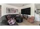 Comfortable living room featuring a large tv, comfortable seating, and sport themed decor at 3511 N 39Th Pl, Phoenix, AZ 85018