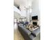 Open-concept living room with high ceilings, a fireplace, and modern furnishings at 3511 N 39Th Pl, Phoenix, AZ 85018