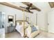 Sunlit main bedroom features a wooden beamed ceiling, fan, and elegant, modern decor at 3511 N 39Th Pl, Phoenix, AZ 85018