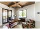Comfortable office space with wood beam ceiling, desk, and natural light at 3511 N 39Th Pl, Phoenix, AZ 85018