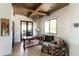 Comfortable office space with wood beam ceiling, desk, and natural light at 3511 N 39Th Pl, Phoenix, AZ 85018