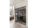 Glass-enclosed wine storage area with ample space for wine bottles and a view into the living area at 3511 N 39Th Pl, Phoenix, AZ 85018