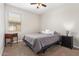 Bedroom featuring neutral walls, carpet, a ceiling fan, and coordinated furniture at 41005 W Crane Dr, Maricopa, AZ 85138