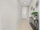 Entryway featuring tile floors, a console table, and modern decorative accents at 41005 W Crane Dr, Maricopa, AZ 85138