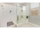Bathroom featuring a glass enclosed shower with a seat and built in shelving at 41005 W Crane Dr, Maricopa, AZ 85138
