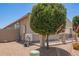 Side yard featuring a fenced area with desert landscaping at 41005 W Crane Dr, Maricopa, AZ 85138