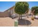 Side yard featuring a fenced area with desert landscaping at 41005 W Crane Dr, Maricopa, AZ 85138