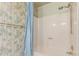 This bathroom features a shower/tub and decorative bamboo wallpaper at 4402 W El Caminito Dr, Glendale, AZ 85302