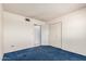This bedroom features plush blue carpet, creating a cozy retreat at 4402 W El Caminito Dr, Glendale, AZ 85302