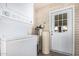The laundry room offers side-by-side washer and dryer at 4402 W El Caminito Dr, Glendale, AZ 85302